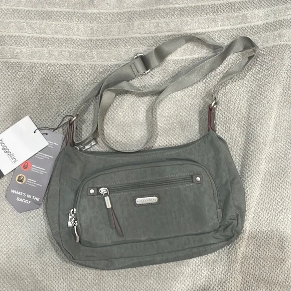 Baggallini. Brand new with tags. Grey with subtle cheetah print background. - Picture 1 of 12